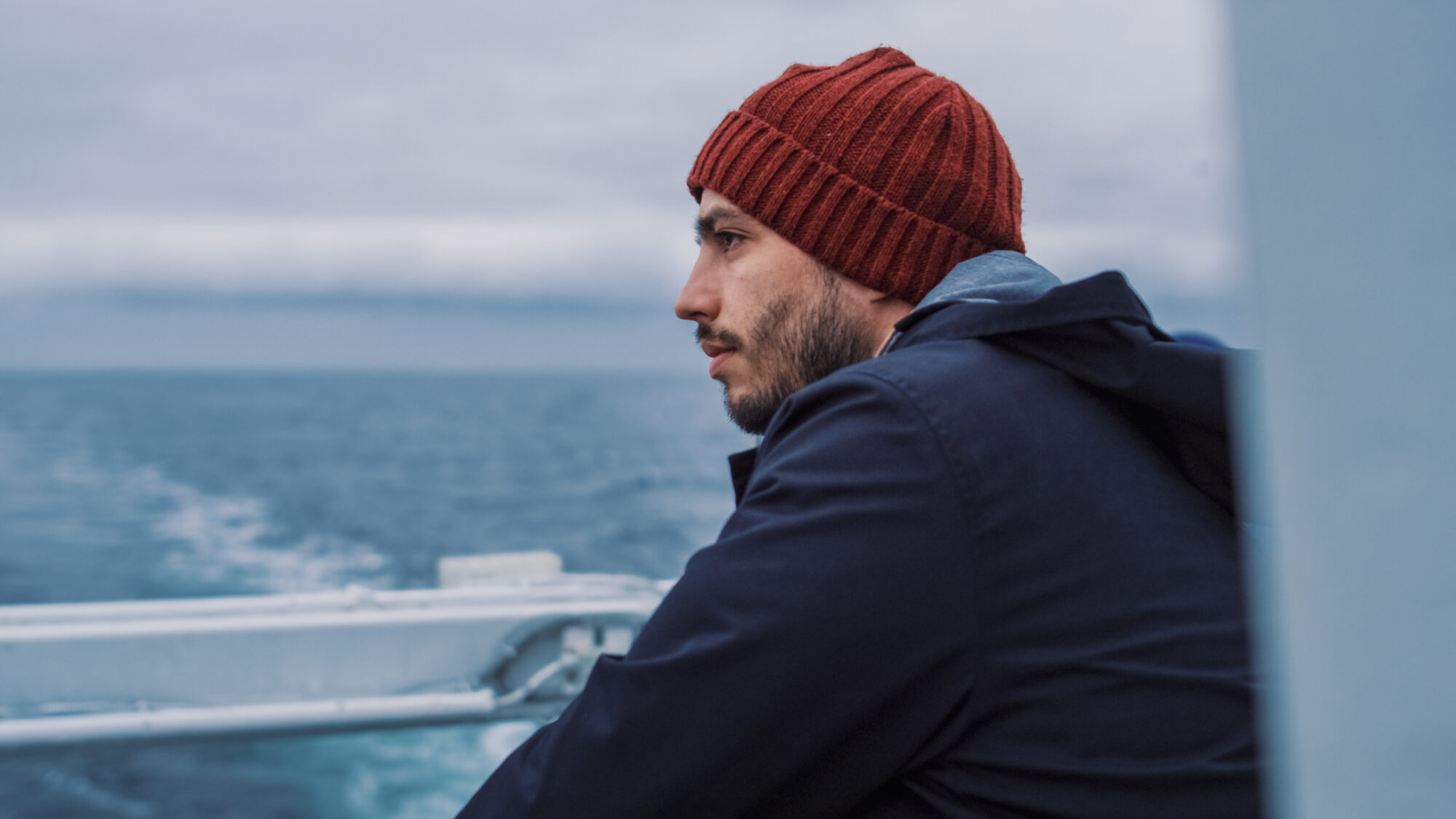 Shot of a Serios Sailor Stands on the Ship and Thoughtfully Looks At the Sea.