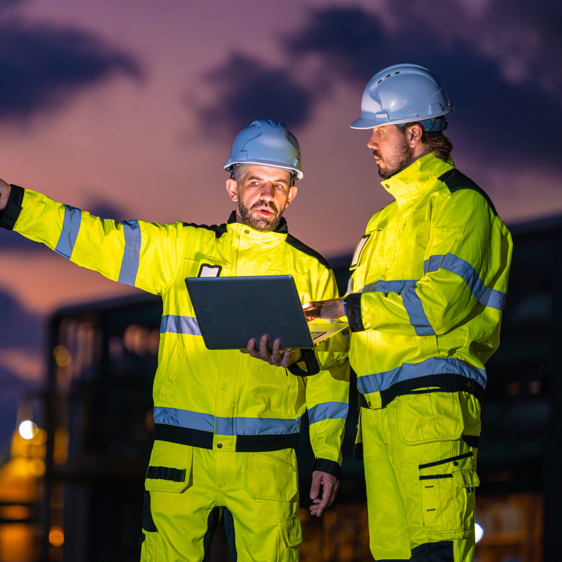 Professional Engineer Team Working at Petroleum Refinery Plant Background in Evening Twilight Sky. Oil Gas Energy Industry Working Service Maintenance People.